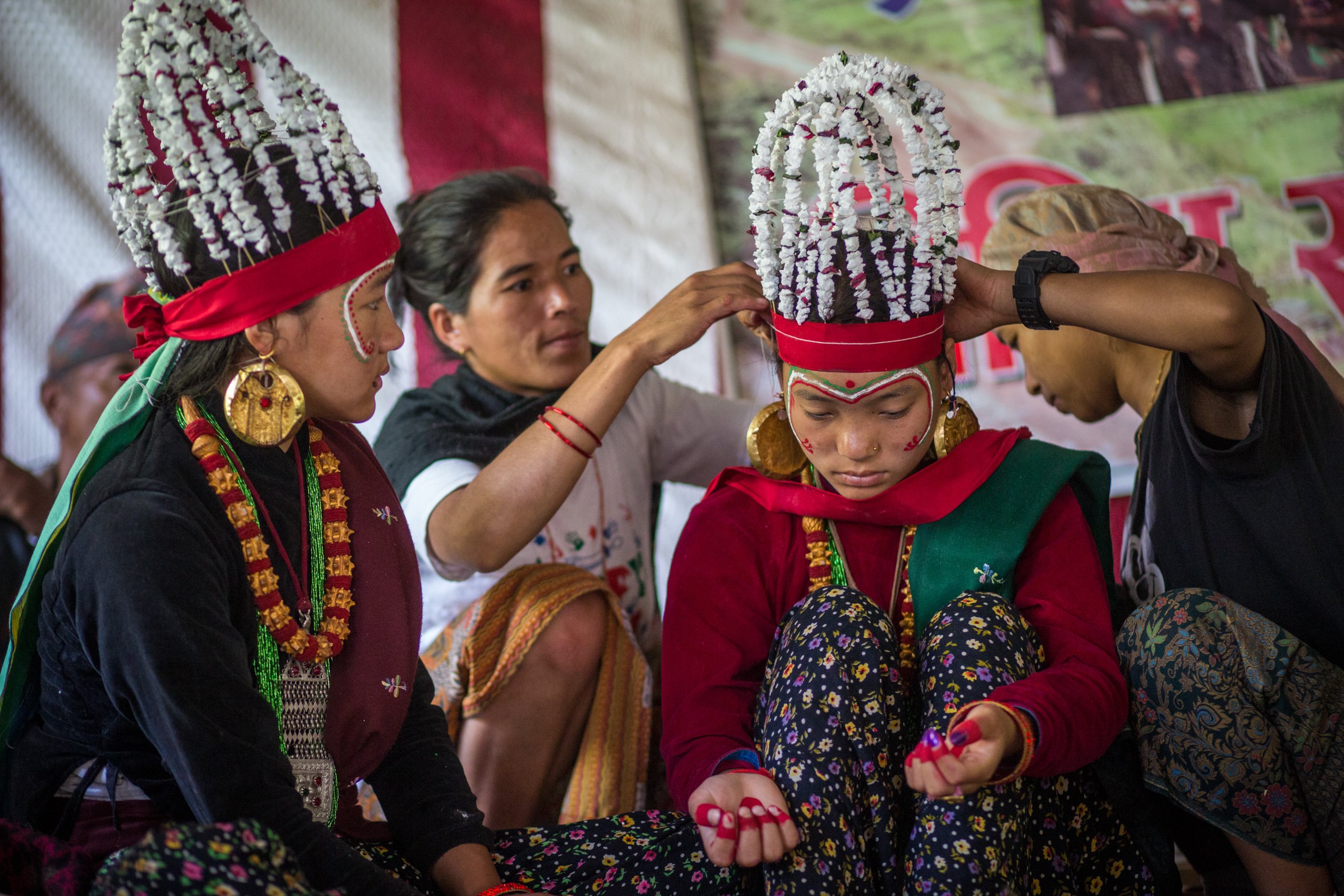 Women in Naiche prepare young girls for Ghatu, a dance performed during the Baishak Purnima full moon festival – one of the biggest festivals in Gurung culture