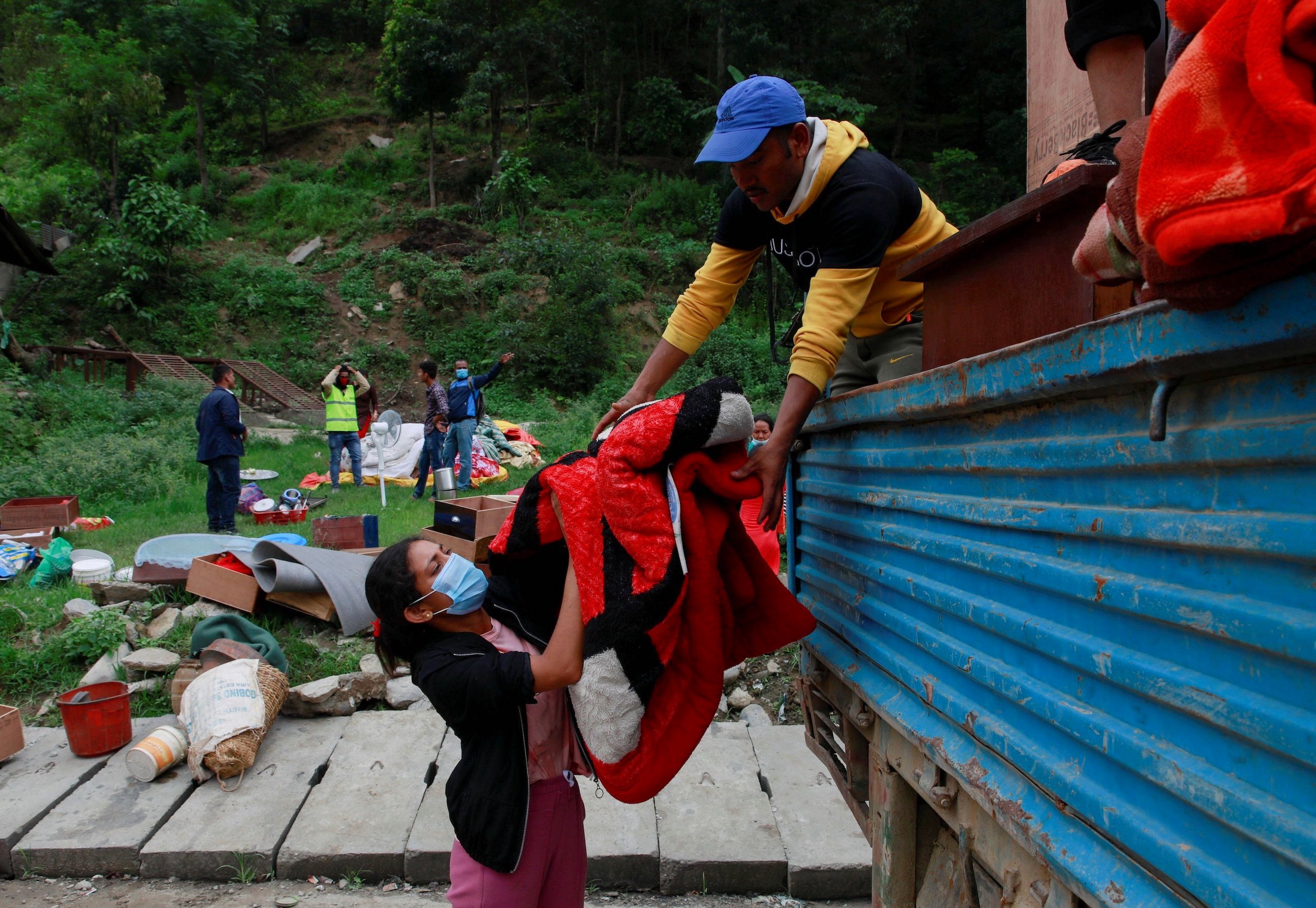 <p>Residents of Sindhupalchok, Nepal, gather their belongings as they move towards higher ground, away from floods that hit the area in June 2021. Nepal’s preparedness for climate disasters like this is being hampered by confusion over which part of government &#8211; central, regional or local &#8211; has responsibility for policies to mitigate and adapt to global warming. (Image: Navesh Chitrakar / Alamy)</p>
