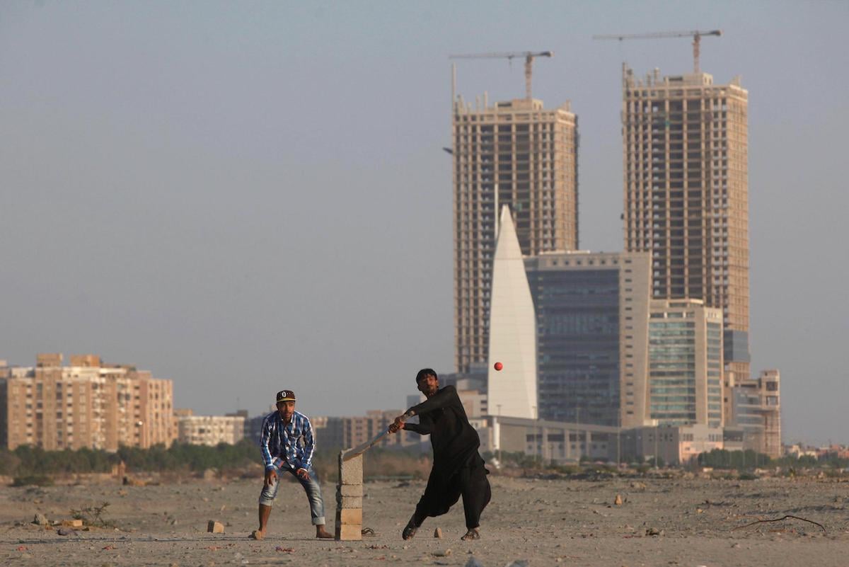 People play cricket on Sea View beach in Karachi, with the Hyperstar shopping mall and under-construction buildings in the background. Just along the coast from here is Phase 8 – a huge development being carried out by Pakistan’s military housing authority.