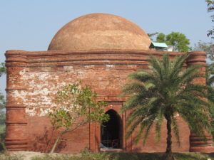A domed mosque with white marks on part of the brickwork, S Inzamamul Haque