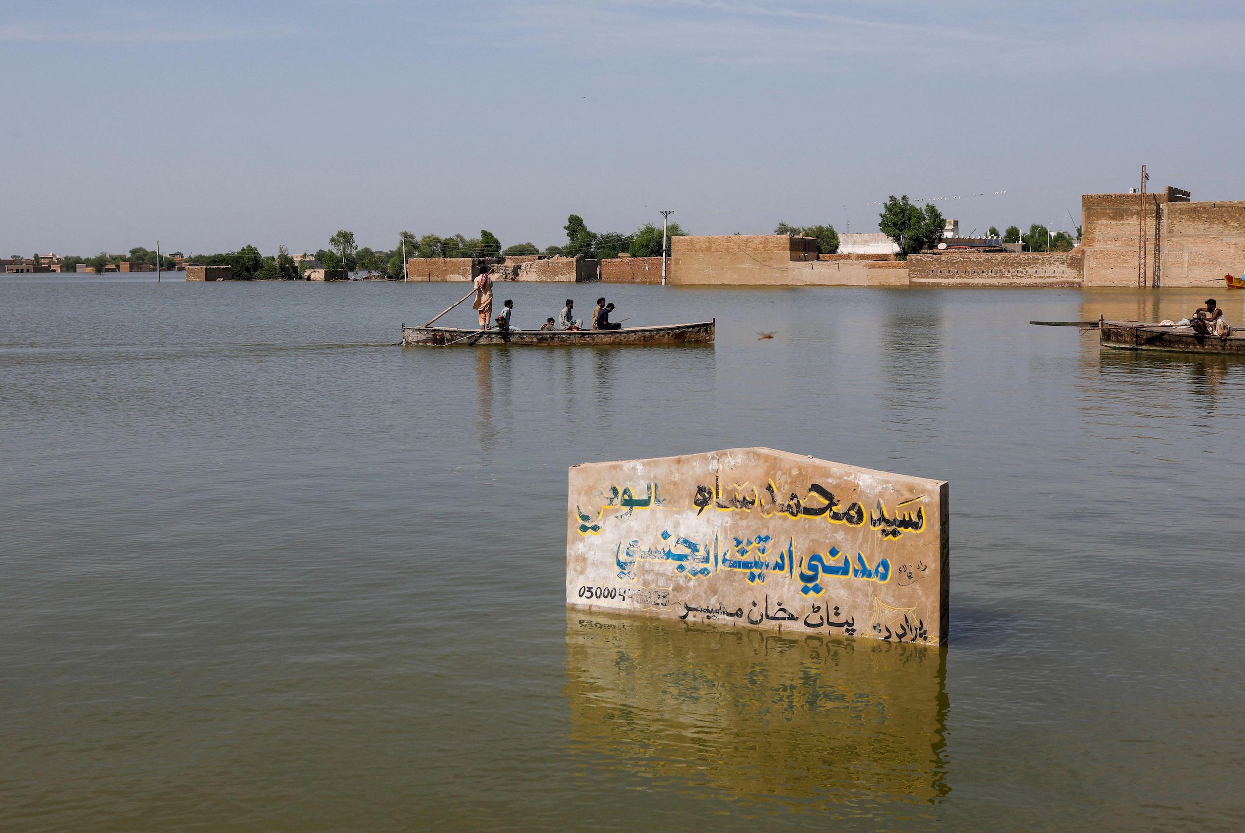 <p>Houses submerged by flood waters following extreme monsoon rainfall in Mehar, Pakistan, this August (Image: Akhtar Soomro / Alamy)</p>