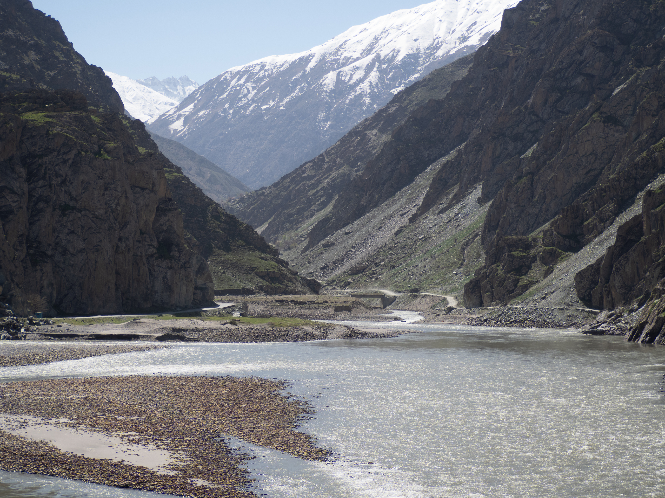The Pamir Highway (left of image) follows the Panj River, which forms the border between Tajikistan and Afghanistan in Darvoz district 