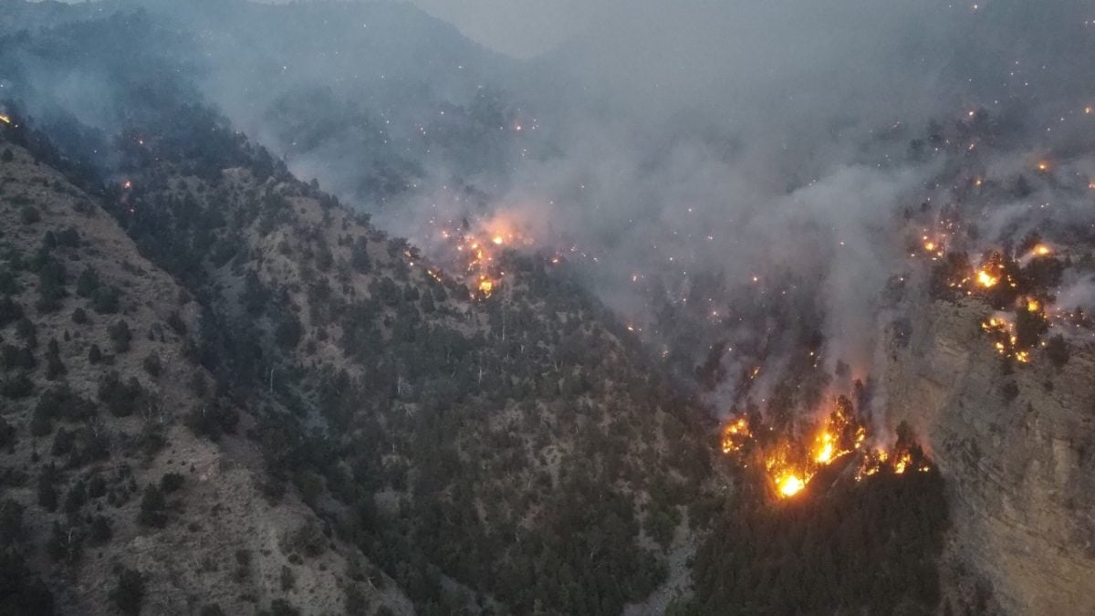 fires burning in hilly area