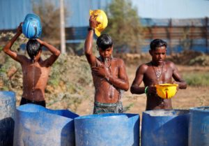 Workers cooling themselves at construction site in Ahmedabad, India
