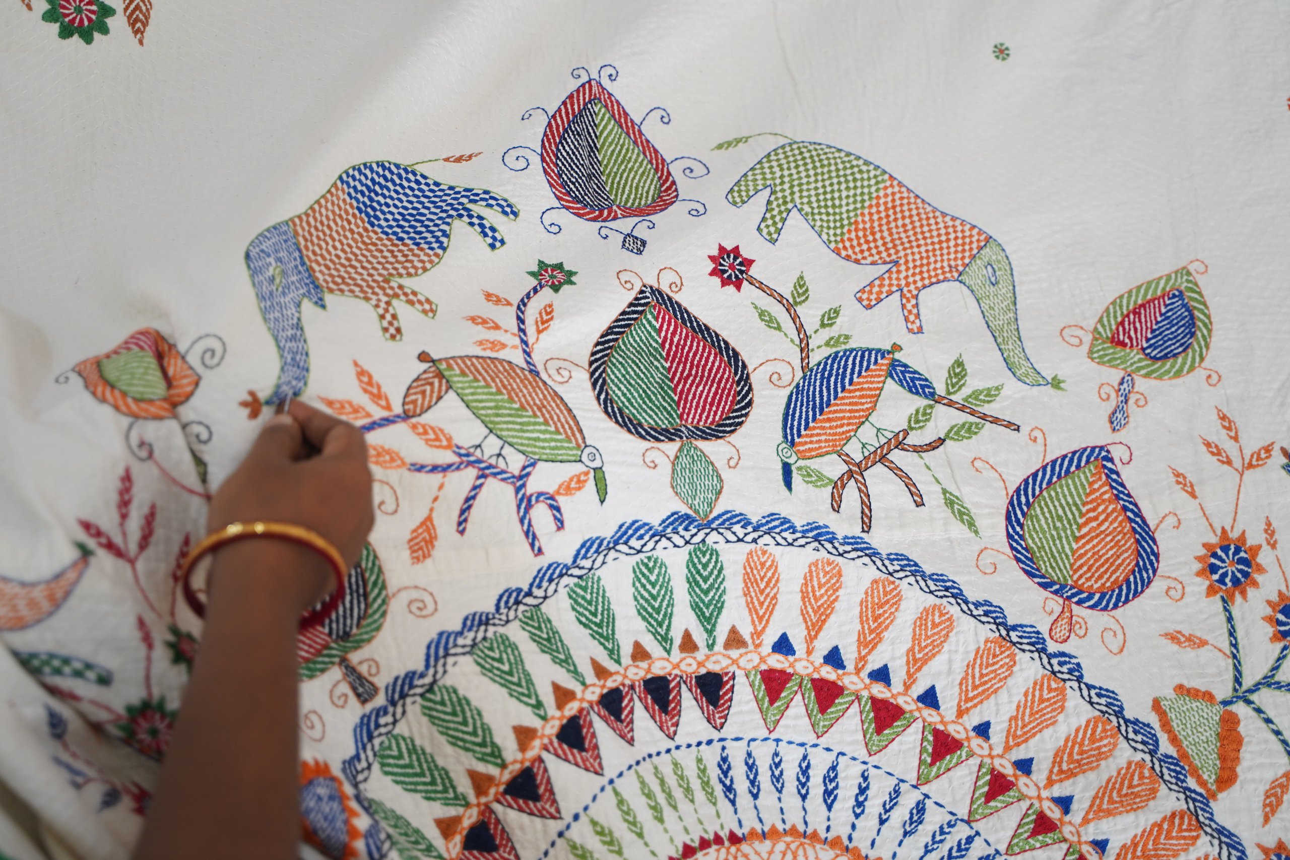 colourful embroidery on white cloth