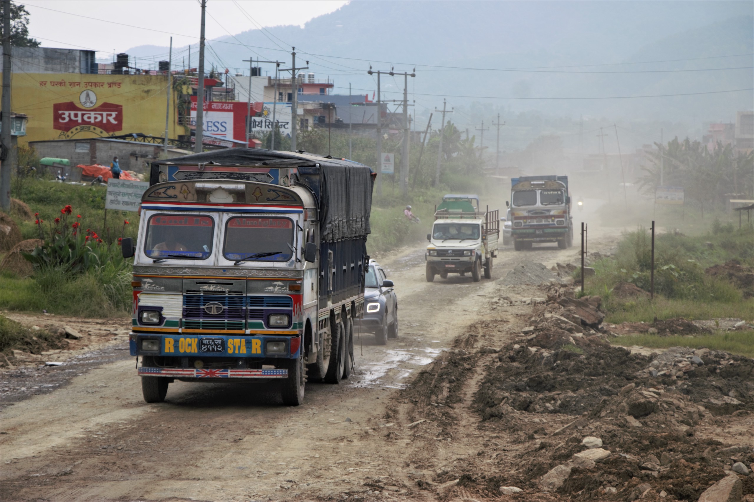 Vehicles on the Pokhara-Mugling Highway in western Nepal. Widening of the road has resulted in severe dust pollution for residents living along the road.