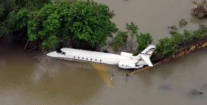 <p>A plane floating at Chennai International Airport after floods swept through southern India in December 2015. Designing better flood-defence urban infrastructure is one example of climate adaptation. Such an initiative recognises that climate change is making floods more frequent and extreme, and factors that into planning and development decisions. (Image: Alamy)</p>