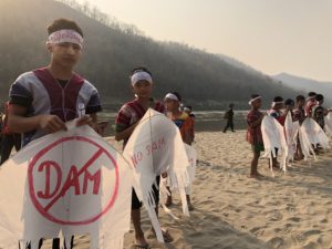 <p>Karen indigenous youth gather on the bank of the Salween River at the Salween Peace Park in Myanmar’s Karen state, on the 2018 International Day of Action for Rivers (Image: Pai Deetes / International Rivers)</p>