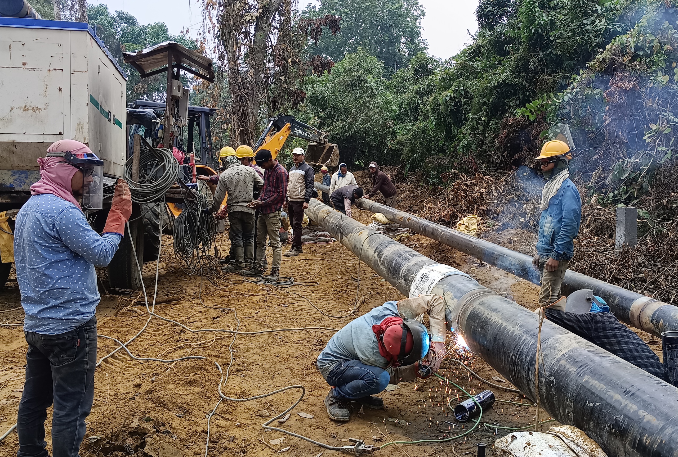 <p>Two new pipelines being laid in late December 2022. The pipelines will connect an oil and gas field in Arunachal Pradesh to a central gas gathering station in Assam, passing through nearly 20 kilometres of protected forest. (Image: Gurvinder Singh)</p>