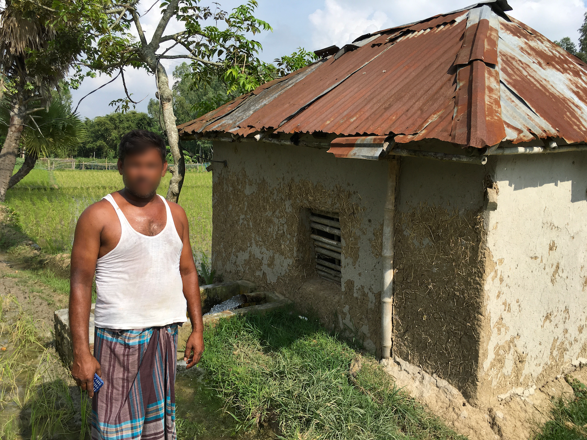 A Bangladeshi water trader in front of his pump house
