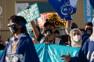 <p>Protesters at COP27 in November 2022 urge rich nations to compensate the communities most affected by the impacts of climate change for loss and damage (Image © Marie Jacquemin / Greenpeace)</p>