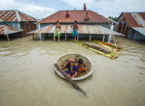 <p>Flooding in Sirajganj, Bangladesh, in July 2020. Melting of glaciers and snowpack in the Himalayas, which hold the third-largest body of frozen water on Earth, has swollen the rivers that flow into Bangladesh from Tibet, Nepal, Bhutan and India. (Image: Moniruzzaman Sazal / Climate Visuals Countdown)</p>