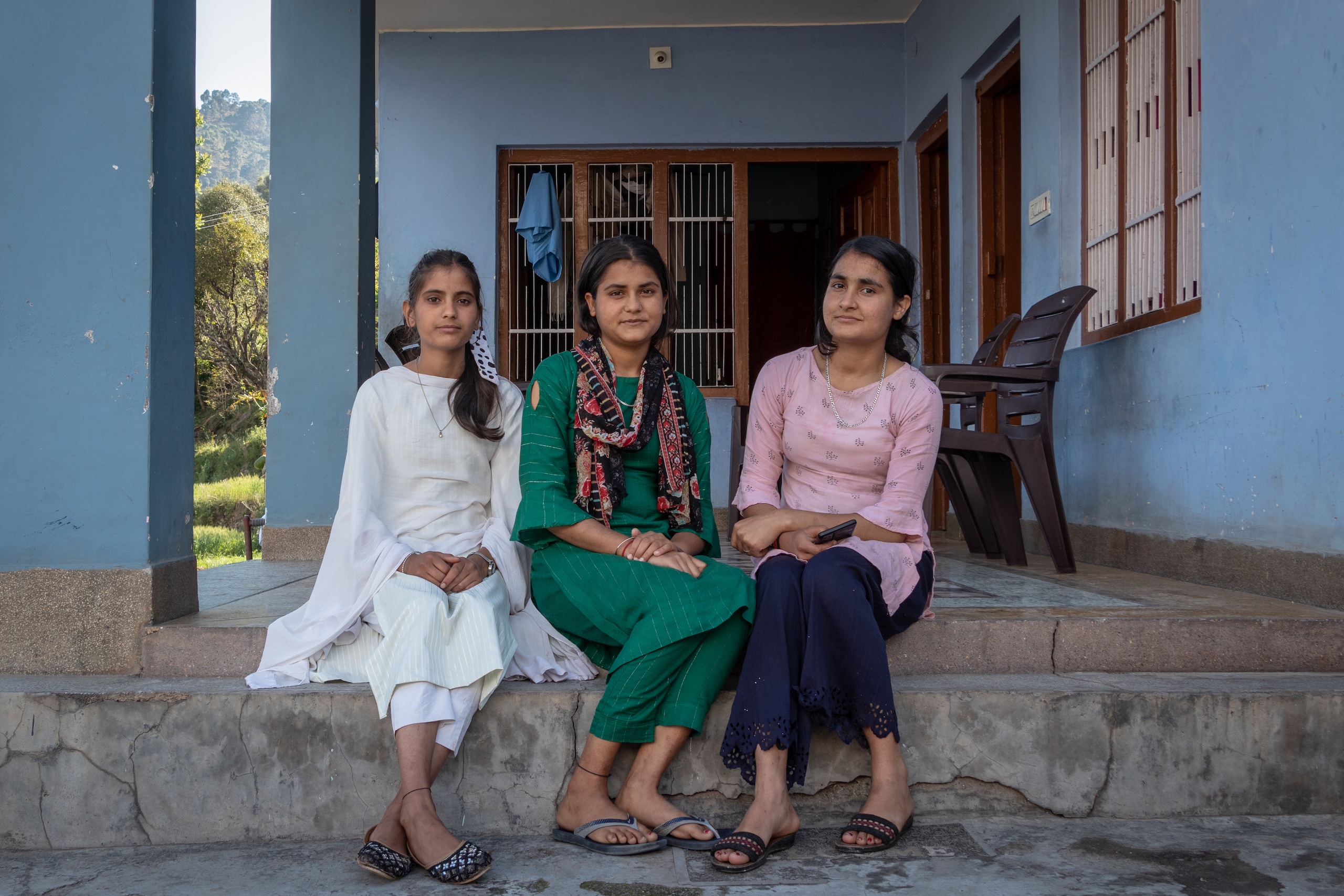 Vaishali Devi (Centre), 16, a school student with her siblings, Jyoti & Poonam pose for a photograph at their home in Kotli village of Reasi district in Jammu and Kashmir. (Image : Ashish Kumar Kataria)