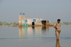 a man standing in flood water