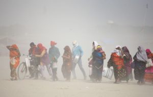 <p>Workers commute during heatwave conditions in Prayagraj, in India’s Uttar Pradesh state, on 7 June 2022. This year, the state has suffered extreme heat once again. (Image: Ritesh Shukla / Alamy)</p>