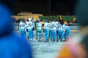 Ice hockey players in a huddle